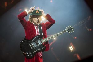 The True Story Of How AC/DC's Angus Young Decided To Wear School Uniforms